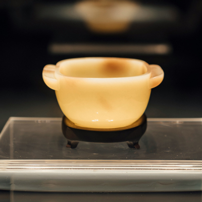 photo of yellow bowl sitting on glass shelf, by Lisk Obe for Unsplash.